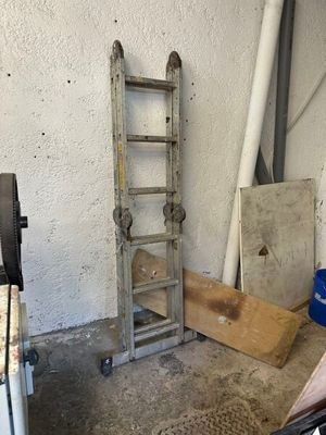a ladder leaning up against a wall in a garage