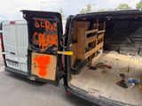 a van that has been vandalized with graffiti on it
