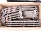a lot of train tracks in a box on a table