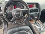 dashboard of a car with a steering wheel and dashboard gauges