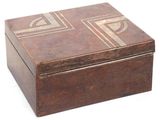 a wooden box that has a design on it