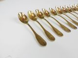 a lot of spoons that are sitting on a table