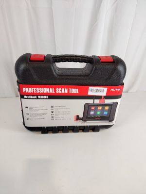 an image of a black and red tool case sitting on top of a white table