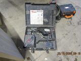 an image of a tool kit sitting on the floor in a garage