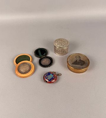 five different types of jewelry sitting on a white surface