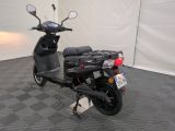 a scooter that is parked in a room