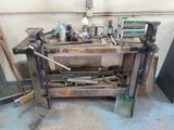 a workbench with tools on top of it in a garage