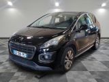 a picture of a small black car parked in a garage