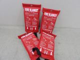 three red fire blanket bags sitting on top of a white surface
