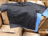 a pile of boxes and a t - shirt on top of it