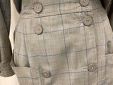 a close up of a woman ' s skirt with buttons on it