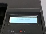 a close up of a cell phone with a charger on it