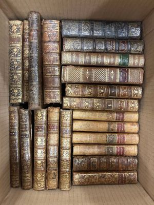 many old books in a box on the table