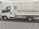 a white truck that is parked in a garage