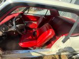 an image of a car with a red seat and dashboard