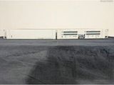 a picture of a train on the tracks in the middle of a field
