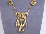 a close up of a necklace on a mannequin mannequin