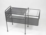 black metal mesh serving cart with two trays on wheels