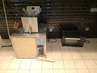 a microwave and a toaster sitting on a counter in a kitchen