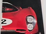 the front cover of a magazine with a picture of a red sports car
