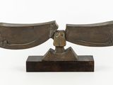 an image of a bronze sculpture of a man holding a sword