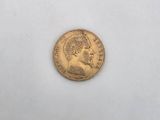 a gold coin with a portrait of a man on it