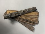 a close up of a bunch of sticks of wood on a table