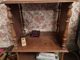 a small table with books on it in a living room