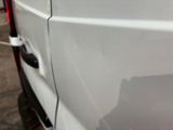 a white van with a black cat on the side of it