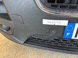 a close up of a car ' s front bumper with a european flag on it