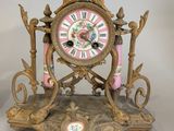a clock that is sitting next to a pair of scissors