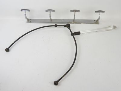 a close up of a metal hook on a white surface