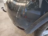 a close up of a car ' s front bumper with a hole in it