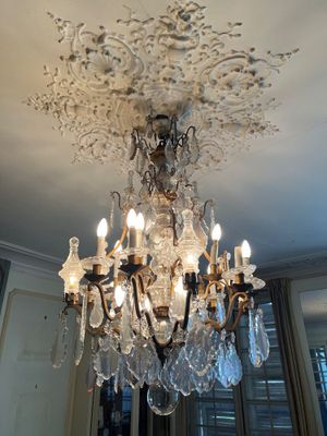 a chandelier that is hanging from the ceiling in the room