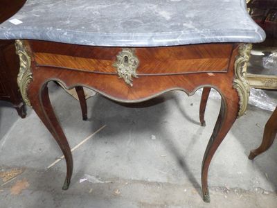 a marble top table with a marble top on it