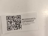 a sticker with a qr code on it on a table