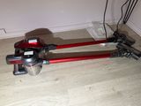 a vacuum that is sitting on the floor in the room