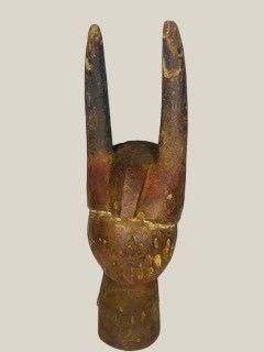 statue of a hand holding a peace sign made out of wood