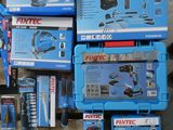 boxes of tools are stacked on top of each other on a table