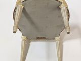 an image of a chair with a mirror on the back of it