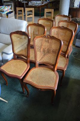 a lot of chairs and a couch in a room