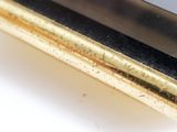 a close up of a cell phone on a white surface