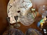 a shelf with a lot of glass items on top of it