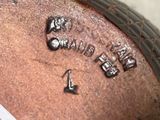 a close up of a metal object with writing on it