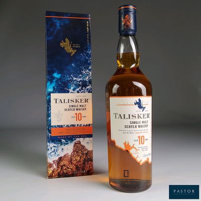 a bottle of whisky next to a box of whisky