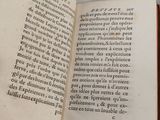 an open book on a white table with a black and white picture