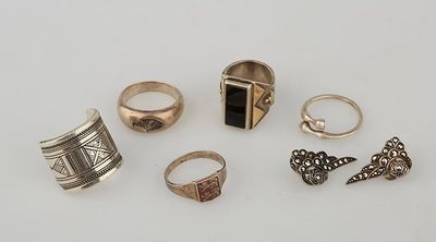 several different rings and rings on a white surface