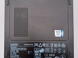 the back of the lenovo laptop is showing the battery cover