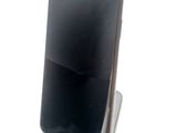a cell phone that is sitting on top of a stand