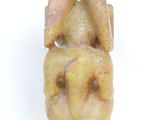 an image of a statue of a dog with a head made out of clay